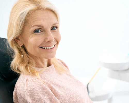 woman smiling in dental chair