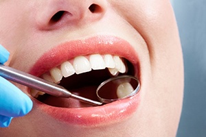 a patient getting a dental checkup with a dentist in Bedford