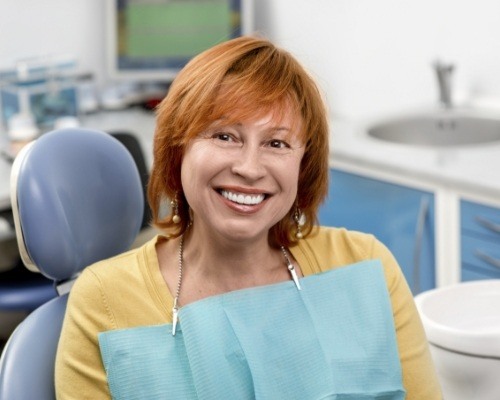 Senior woman smiling in dental chair