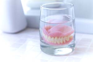 Dentures in Bedford soaking in glass