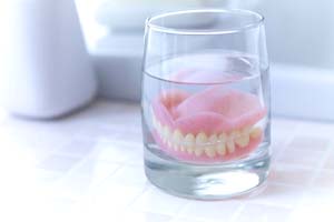 Man with mustache smiling during his dental visit