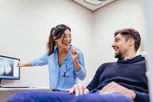 Patient smiling while visiting emergency dentist in Bedford