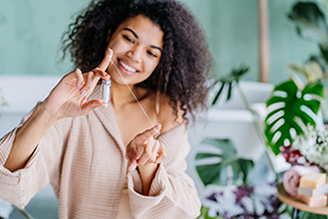 Woman with floss wrapped around her index fingers