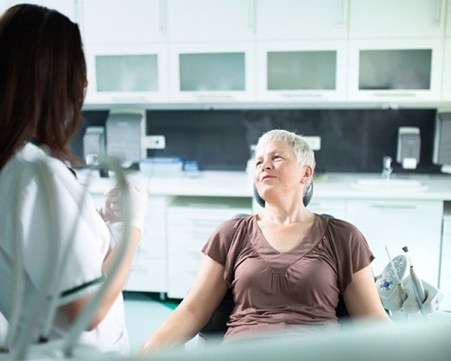 Patient and dentist discussing candidacy for dental implants