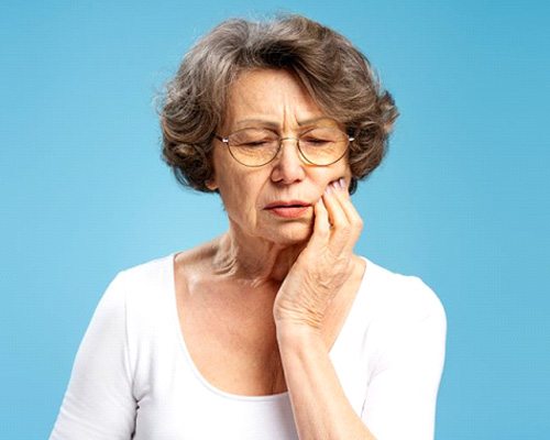 Senior woman with a toothache