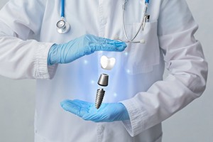 hologram of a dental implant between a dentist’s hands 