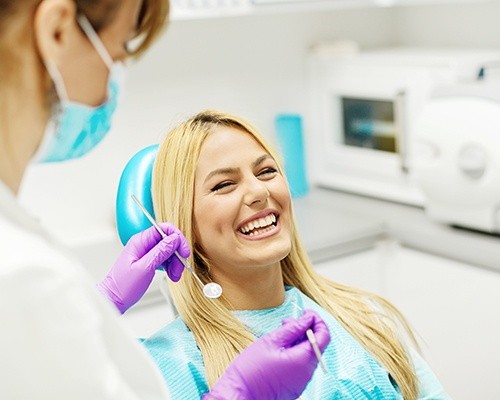 Woman laughing during dental checkup