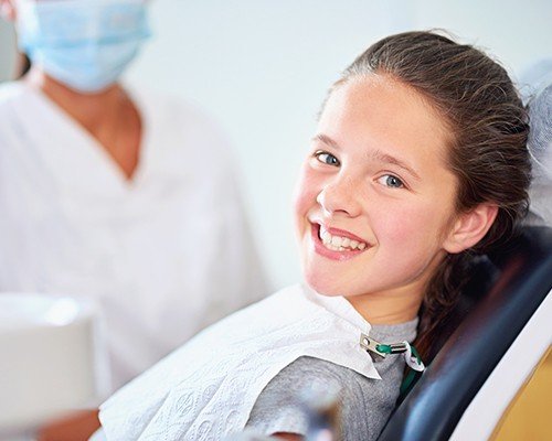 child smiling after receiving dental sealants