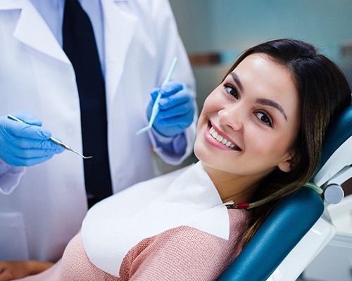 Patient smiling in dentist's treatment chair