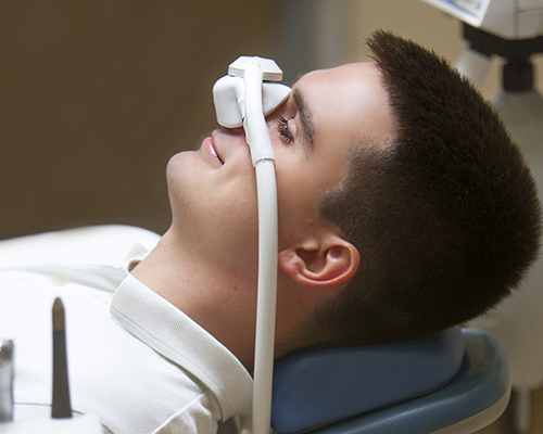 Man being administered nitrous oxide sedation