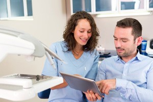 Patient pointing at an iPad