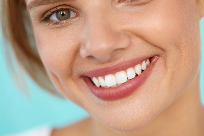 An up-close image of a woman and her healthy, brighter smile