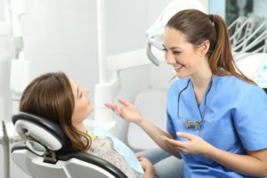 woman chatting with her dental hygienist 