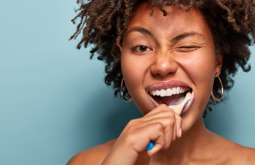 Woman brushing teeth
